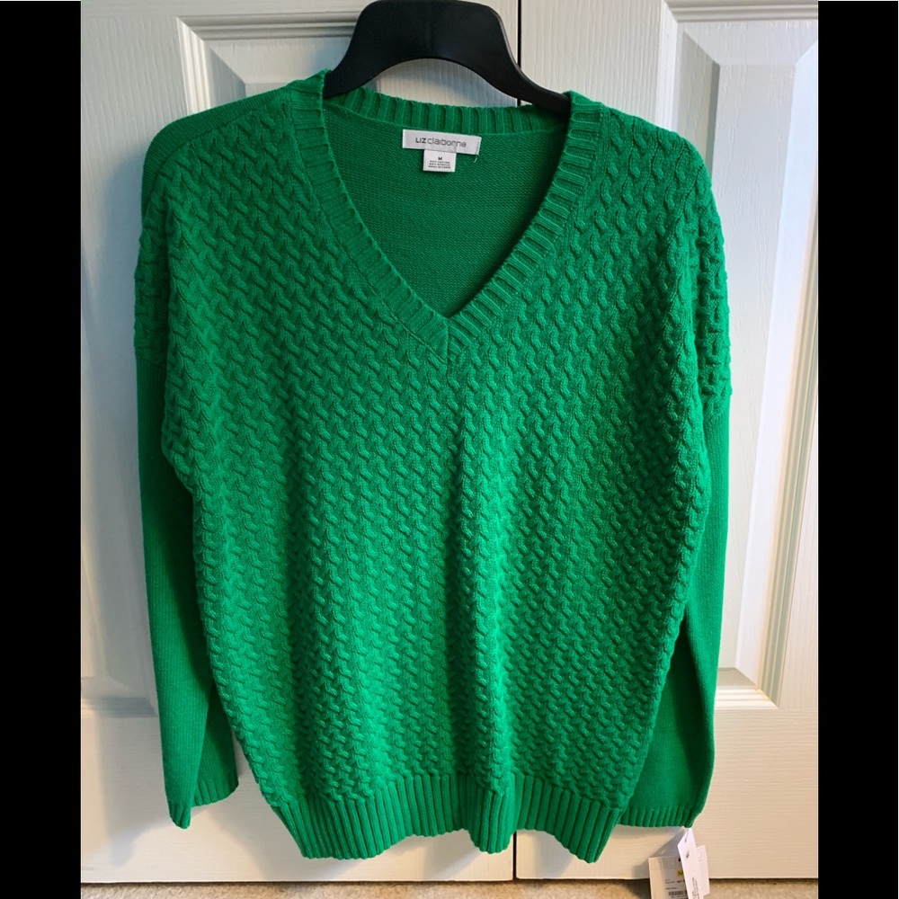 Green V neck sweater.